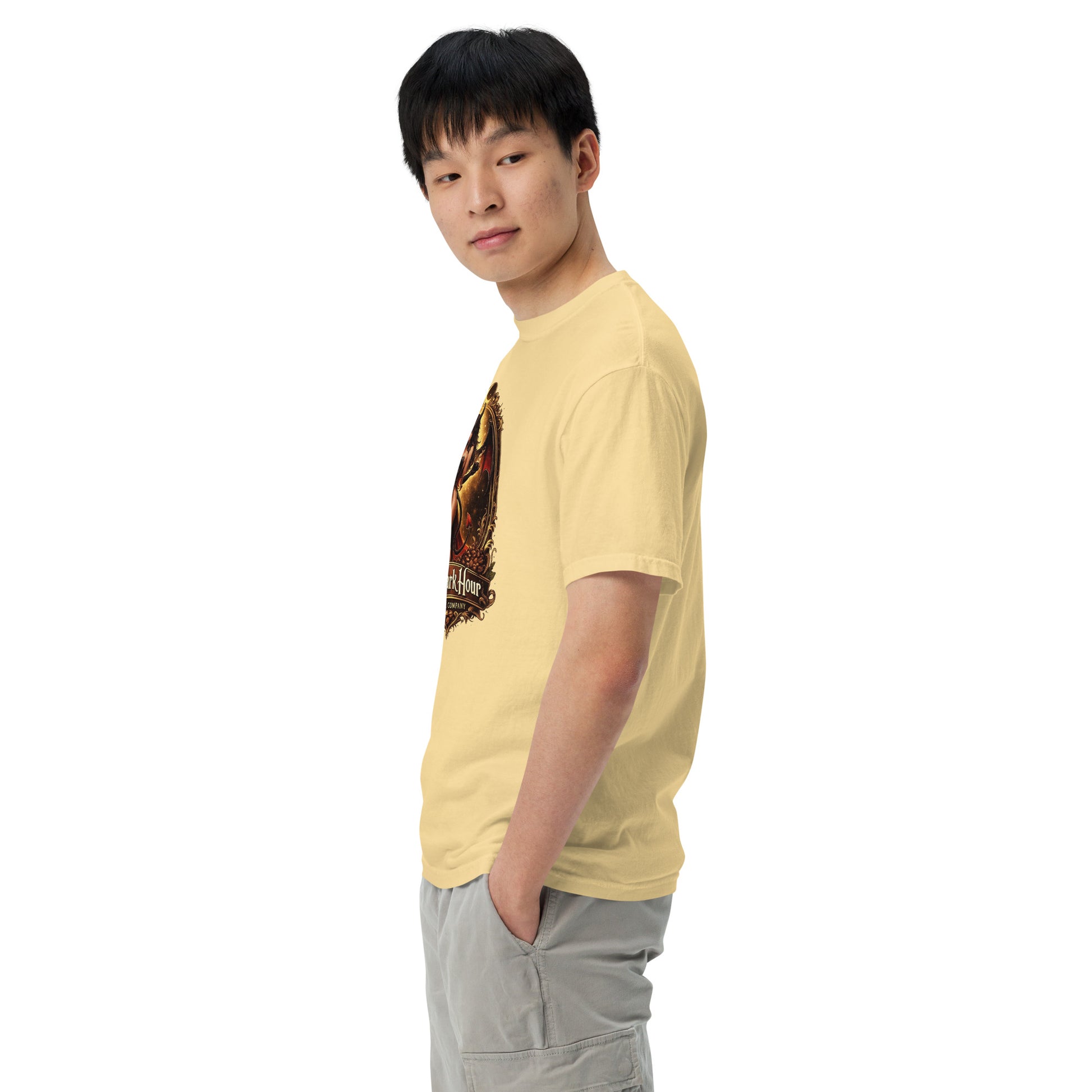 Unisex garment-dyed heavyweight T-shirt in butter color from The Dark Hour Coffee Company, shown from the left side.